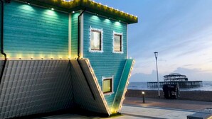 A teal building with two windows, a slanted roof, and a beach view. - Coastal Breeze With Seaview By My Getaways (Brighton)