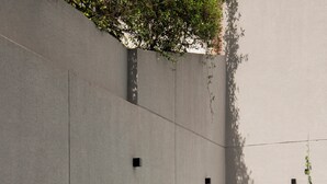 A swimming pool with a concrete border and lush greenery. - Top Rentals Palermo Soho (Buenos Aires)