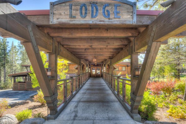 Walk to the Lodge along a covered path supported by sturdy beams and railings.