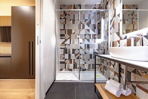 Superior Room | Bathroom | Hair dryer, towels, soap, shampoo