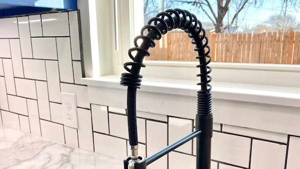 A kitchen with a modern faucet, a dish rack, and a window with a view of trees. - 12 Minutes from Crossbar and Turner Falls, Sleeps up to 10, Fast Wi-Fi (Davis)