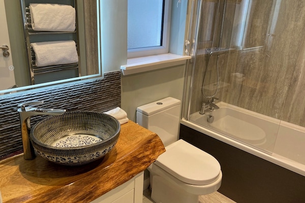 Eco-friendly toiletries, hair dryer, towels, soap