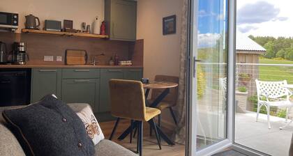 Pet-friendly luxury garden apartment surrounded by woodland and fields.