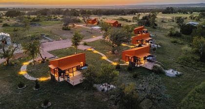 Luxury cabin in the center of the Texas Wine Country; large private porch w/hot tub, gas grill and fire pit; pet friendly