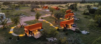 Luxury cabin in the center of the Texas Wine Country; large private porch w/hot tub, gas grill and fire pit; pet friendly
