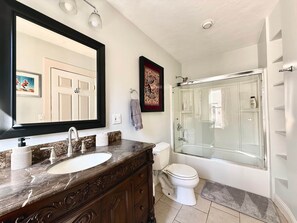 Hair dryer, towels, shampoo, toilet paper