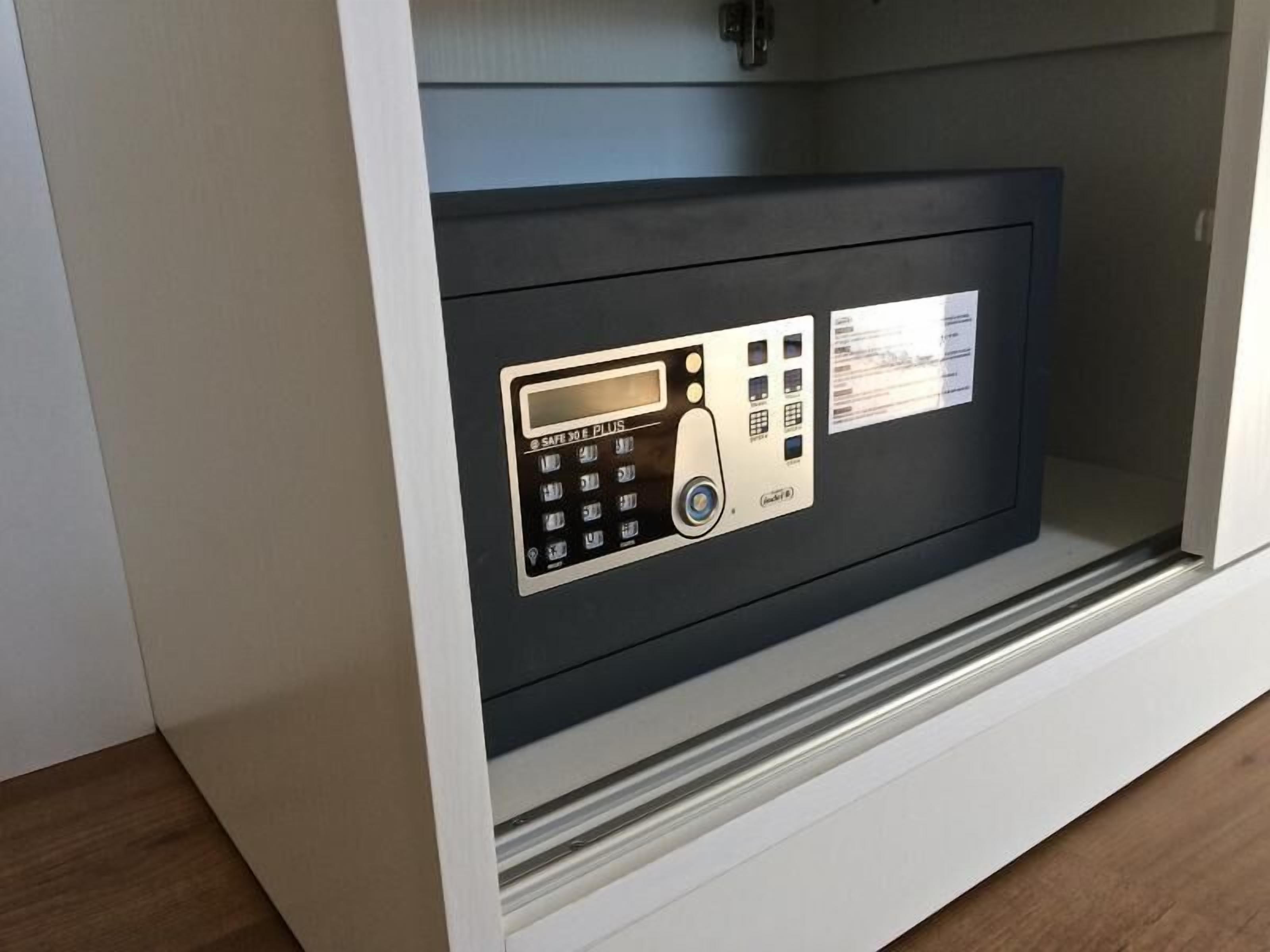 A safe with a keypad and a card reader, indicating a secure storage feature.