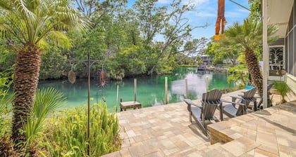 Stay directly on crystal clear waters of Weeki Wachee River with your own beach!