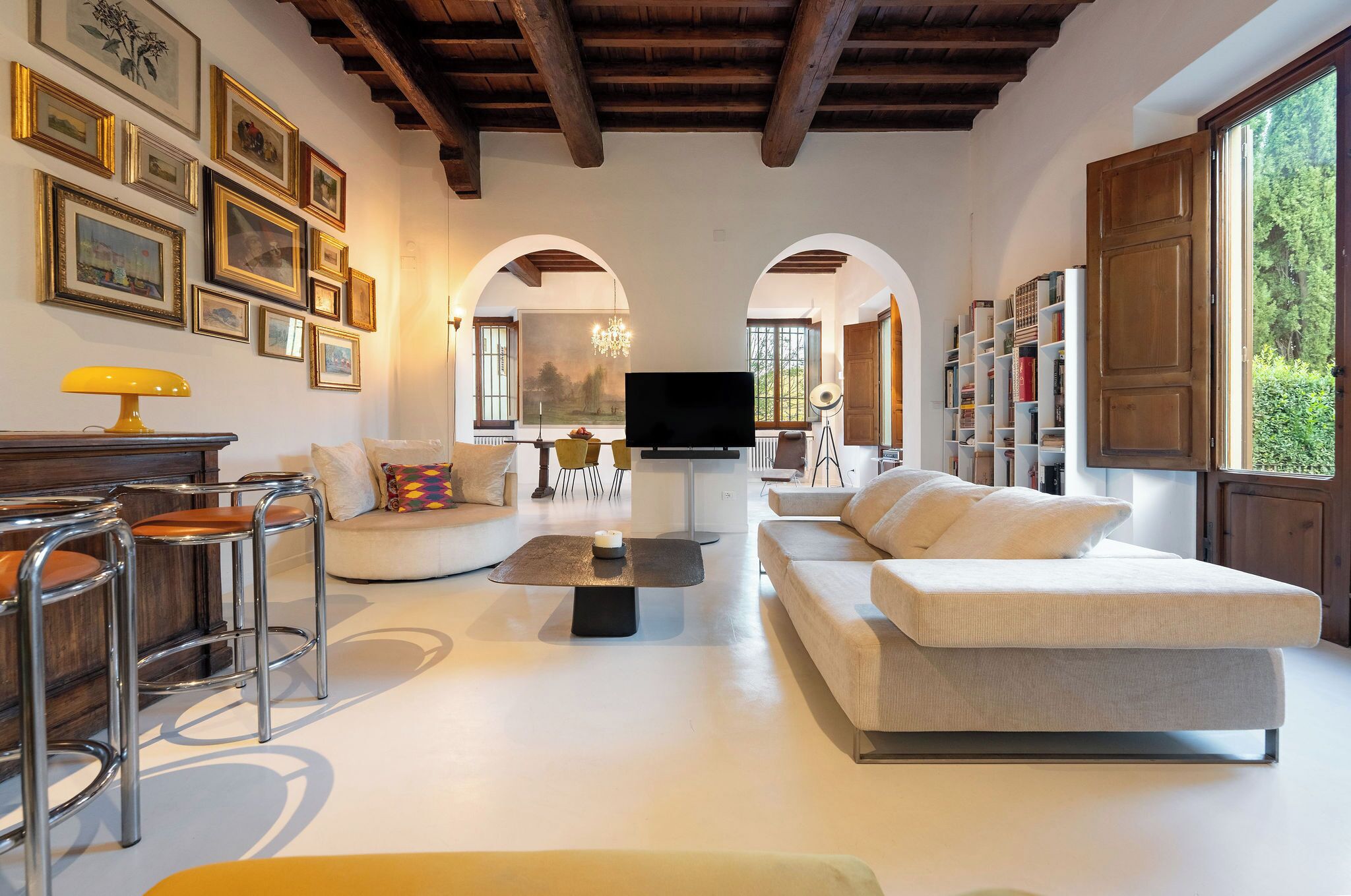 Smart TV, fireplace, books, computer monitors