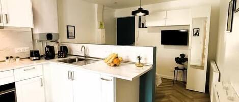 Fridge, microwave, stovetop, coffee/tea maker