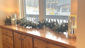 A wooden cabinet with drawers and a window above. - Ski in/out @Base Lodge at  Clock tower,Okemo. Building B  Ground Level sleeps 6 (Ludlow)