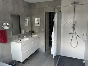 Shower, hair dryer, towels, toilet paper
