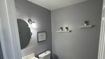 Shower, towels, soap, toilet paper