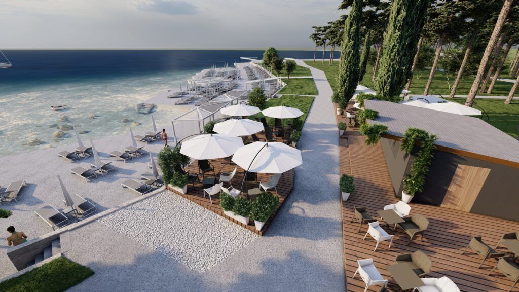 A beachside resort with sun loungers, umbrellas, and a dining area overlooking the sea.
