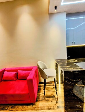 Luxury Suite, Balcony, Corner | Living area | 55-inch Smart TV with digital channels - The Spotlight (Greater Noida)