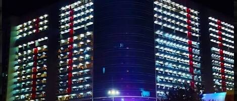 A multi-story building with balconies, labeled "LAUR CITY CENTER" and "LPW."