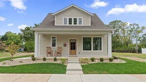 A two-story house with a front porch, a mailbox, and a number 913 sign. - NEW BUILD - Walk to Notre Dame, Eddy Street Trader Joes only a half mile away (South Bend)