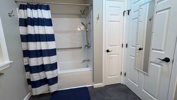 Shower, hair dryer, towels, toilet paper