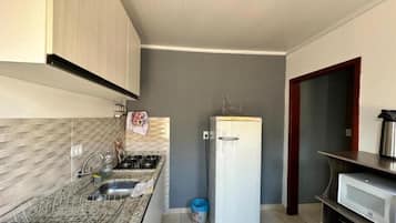 Fridge, microwave, stovetop, cookware/dishes/utensils