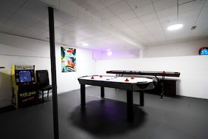 Games room - Stay & Play 1720 | Arcade Family Pets Yard Firepit (Calgary)