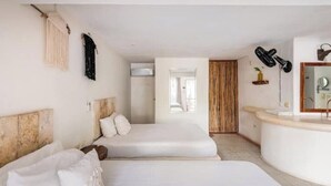 A hotel room with two beds, a bathroom with a mirror, and a window. - Twin Room on 5th A06 (Playa del Carmen)