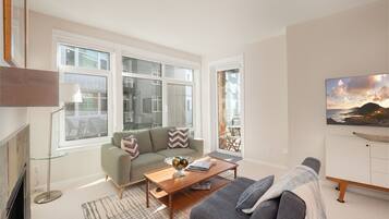 Smart TV, fireplace, books, offices