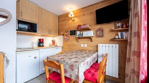 A compact kitchen with a microwave, coffee maker, and a small refrigerator. - Nice and bright apt for 4 pers (Morillon)