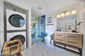 Shower, hair dryer, towels, soap