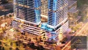 A high-rise hotel with multiple floors, balconies, and a rooftop pool. - Metropole Residences Luxury Suite (Ho Chi Minh City)