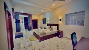 Deluxe Triple Room, Balcony | In-room safe, desk, laptop workspace, soundproofing