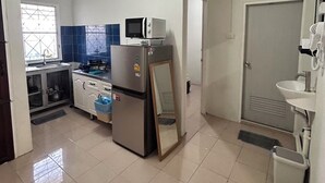 A kitchen with a refrigerator, microwave, and sink. - The Endless Bangtao Residence: PM1 (Thalang)