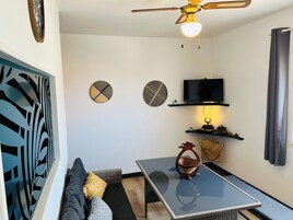 Apartment | Living area | 87-cm flat-screen TV with satellite channels