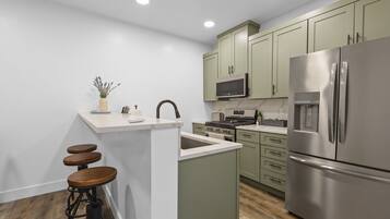 Coffee/tea maker, fridge, microwave, oven