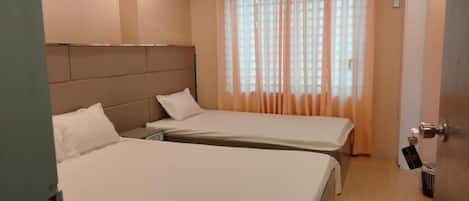 Deluxe Triple Room, City View | In-room safe, desk, laptop workspace, free WiFi
