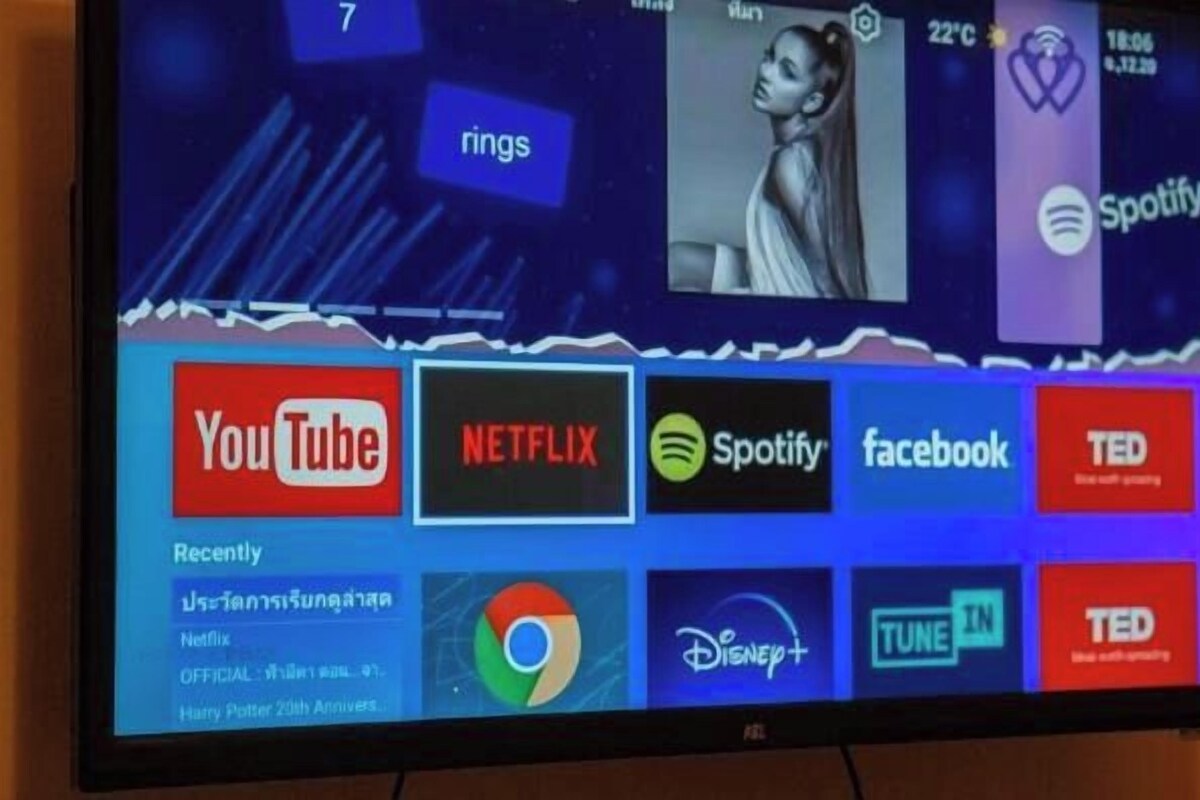 A television screen displaying various streaming service logos and a 'Recently' section with additional service icons.