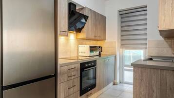 Fridge, microwave, cookware/dishes/utensils