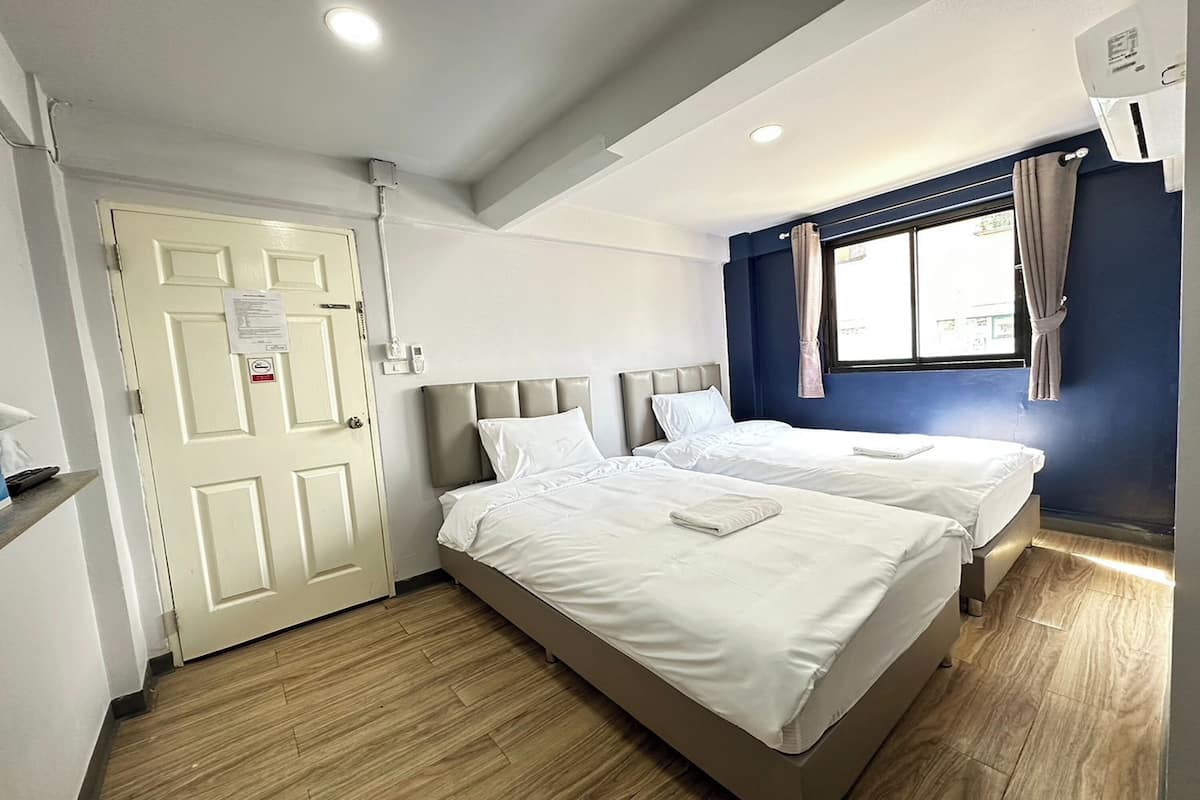 Habitación con 2 camas individuales | Wifi gratis y ropa de cama