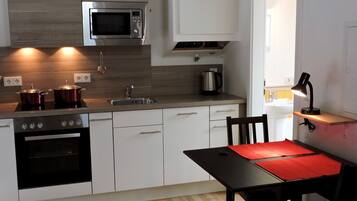 Fridge, stovetop, cookware/dishes/utensils