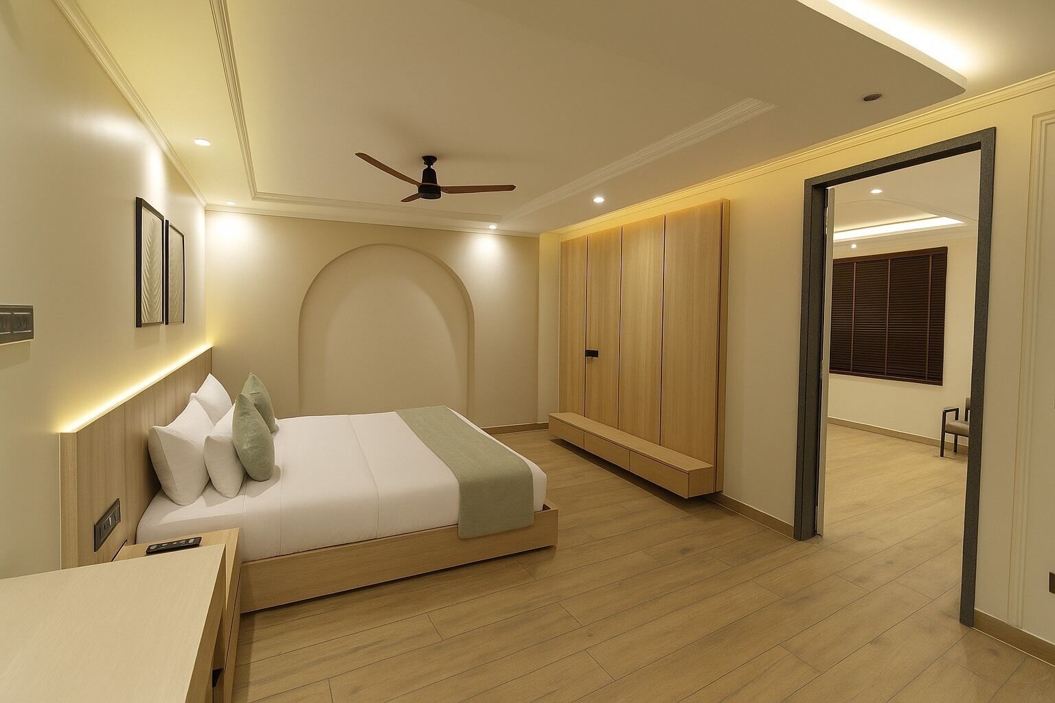 Un dormitorio con cama, mesita de noche, armario, ventilador de techo y vista al pasillo.