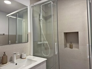 Shower, hair dryer, towels, soap