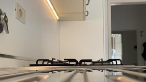 Departamento clásico, balcón, vista a la ciudad | Cocina privada