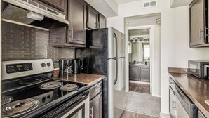 Coffee/tea maker, fridge, microwave, oven