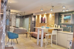 Studio | Living area | 60-cm flat-screen TV with satellite channels - Studio Apartment Eleven (Rovinj)