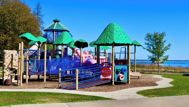 A playground with climbing structures, slides, and a covered seating area. - Near Detroit Metro Area: New Baltimore Home! (New Baltimore)