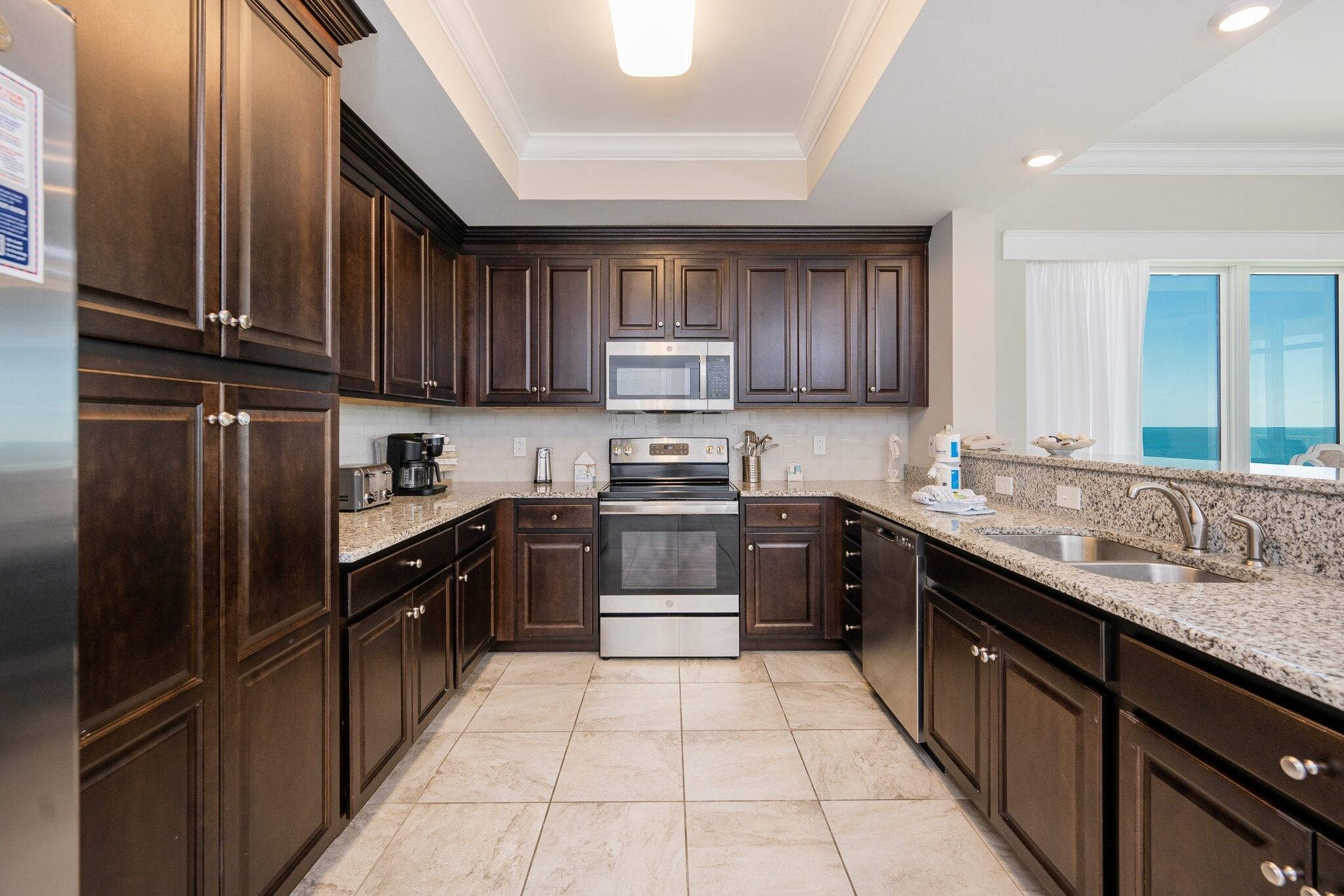 Condo, 4 Bedrooms | Private kitchen | Fridge, oven, coffee/tea maker