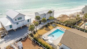 A beachfront property with a swimming pool, multiple houses, and a beach view. - Private Beach Access, Private Pool/Hot Tub, Beach Service, and Pet Friendly! (Santa Rosa Beach)