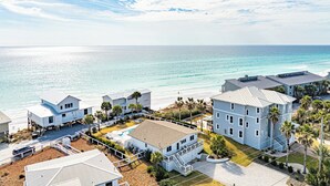 A coastal property with multiple buildings, a swimming pool, and a beach view. - Private Beach Access, Private Pool/Hot Tub, Beach Service, and Pet Friendly! (Santa Rosa Beach)