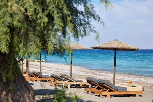 On the beach, sun loungers, beach umbrellas, beach towels
