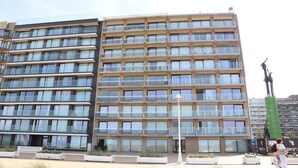 A multi-story hotel with a modern design, featuring balconies and large windows. - Penthouse in Koksijde With Stunning Sea View (Nieuwpoort)