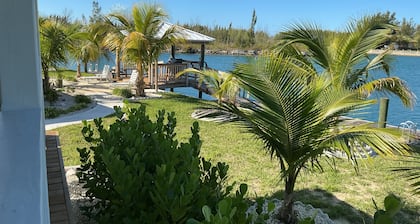 Cozy brand new yellow studio/cottage with free floating dock in Freeport.